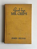 Front cover of mustard cloth book with title and author