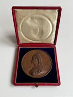 Medal in open red case showing interior lining