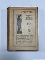 Front of dust-jacketed book displaying title and Osiris illustration