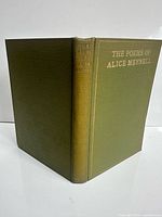 Front and spine view showing cloth cover and gilt titles