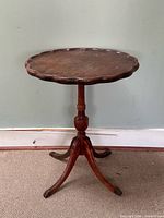 Full view of walnut pie crust edge side table