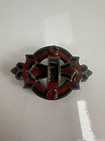 Front view of brooch showing overall design and agate panels