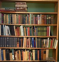 Five full shelves of assorted antique and vintage books
