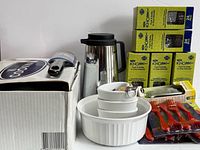 overall lot showing casserole dish, ramekins, heart dishes, Knork boxes, red utensils, carafe, peeler