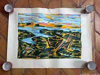 Full view of screenprint held at corners showing abstract landscape