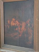 Framed oil painting showing tavern scene with visible vertical split in panel