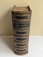 Spine view showing gilt title "Holy Bible" and decorative embossing
