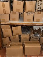 stacked cardboard boxes filled with reusable bags