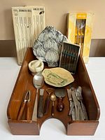 Overview of all items arranged in teak tray with boxed skewers at rear