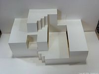 Pop-up stair structure formed by white card pages