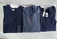 Three navy sweaters side by side: Gap crewneck, Polo quarter-zip, Gap V-neck