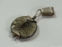 Front view of round crackled gold leaf glass pendant with silver mount