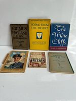 All six books laid out front covers visible