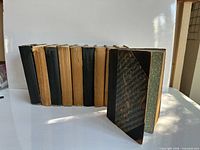 Ten matching hardbound volumes standing upright