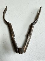 Full view of brass nutcracker opened