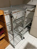 Two metal wire shelves side by side showing overall structure