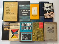 All ten books laid out showing covers and relative condition