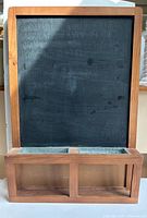 Front view showing chalkboard, trays, letter rack