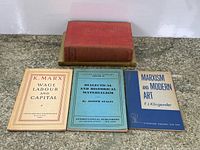 All four books front covers visible