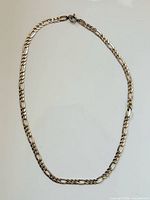 Full view of sterling silver Figaro chain necklace