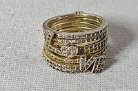 Stacked view showing four rings, letters and heart visible