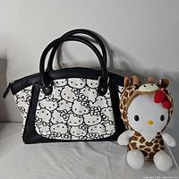 Tote handbag front view beside giraffe plush