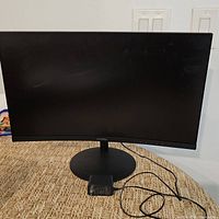 Front view of Koorui curved monitor with stand and cable visible