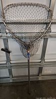 Full view of large Ranger landing net showing hoop, mesh, and handle