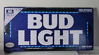 Front of boxed Bud Light LED sign showing product image and branding