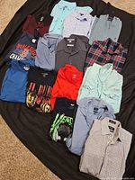 Overview of all shirts spread on black backdrop