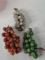 All three vintage faceted bead grape clusters displayed together