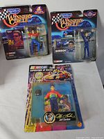 Front view of all three sealed Jeff Gordon action figures
