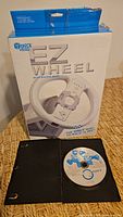 Front view showing Block Head EZ Wheel box and open case displaying Mario Kart Wii disc