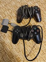 Top view of both controllers with cables coiled