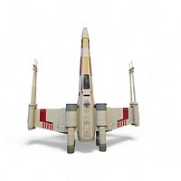 Front view of X-Wing toy with wings closed and laser cannons visible