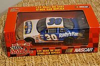 Front view of boxed Racing Champions die-cast stock car #30 Rudy’s Farm
