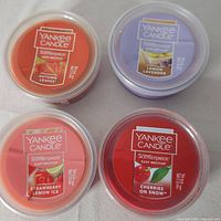 Top view of four Yankee Candle Easy MeltCup wax melts showing scent labels and colors