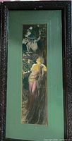 Full view of framed lithograph showing image, mat and ornate frame