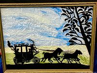 Full view of silhouette painting in frame