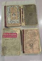 All four books laid out: Fourth and Fifth Readers, Ray Arithmetic, Plain English Handbook