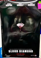 Full view of Blood Diamond poster showing imagery and text