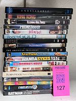 Full stack of DVD cases showing spines and quantity