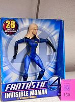 Front view of boxed Fantastic Four Invisible Woman figure displaying character and articulation claim