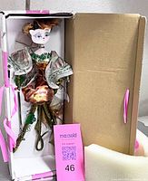 Figurine inside original box displaying overall form and packaging