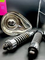 Air cleaner cover front and both shocks overview