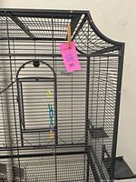 Front and side view of entire bird cage on stand