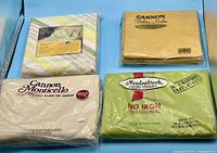 Front view of all four packaged sheets
