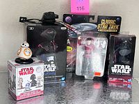 Overview showing boxed Star Wars items, Star Trek figure, BB-8 bobble-head and other packaging