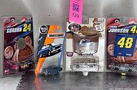 Group shot of all four sealed diecast packages