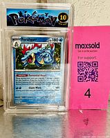 Front view of slab showcasing Feraligatr holo card and Gem Mint 10 label